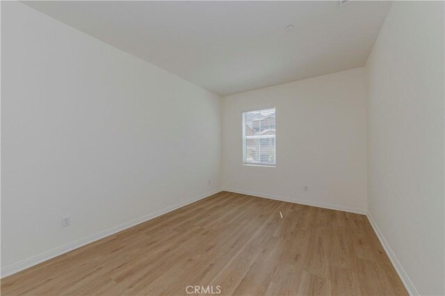 24679 Acadia Dr, Corona, CA 92883 - empty room with light wood-style floors and baseboards