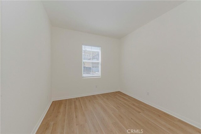 24679 Acadia Dr, Corona, CA 92883 - spare room featuring light wood-type flooring and baseboards