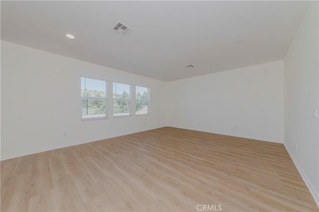 24679 Acadia Dr, Corona, CA 92883 - empty room featuring light wood-type flooring and recessed lighting