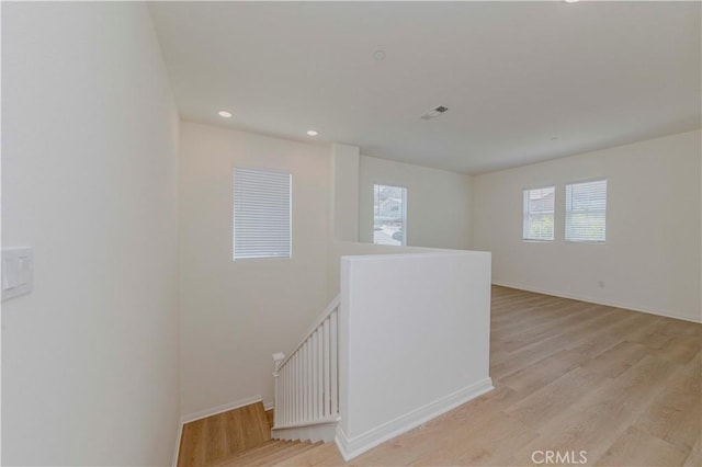 24679 Acadia Dr, Corona, CA 92883 - stairs featuring wood finished floors and recessed lighting