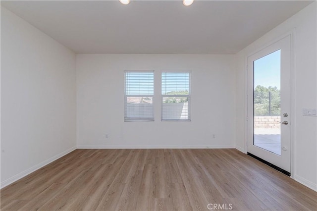 24679 Acadia Dr, Corona, CA 92883 - empty room featuring light wood-type flooring and recessed lighting