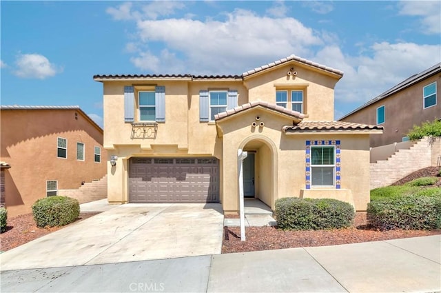24679 Acadia Dr, Corona, CA 92883 - view of front of house featuring an attached garage, stucco siding, driveway, and a tile roof