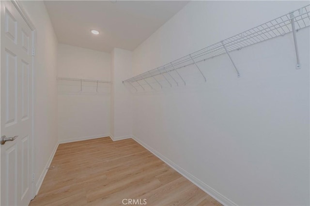 24679 Acadia Dr, Corona, CA 92883 - walk in closet with light wood finished floors