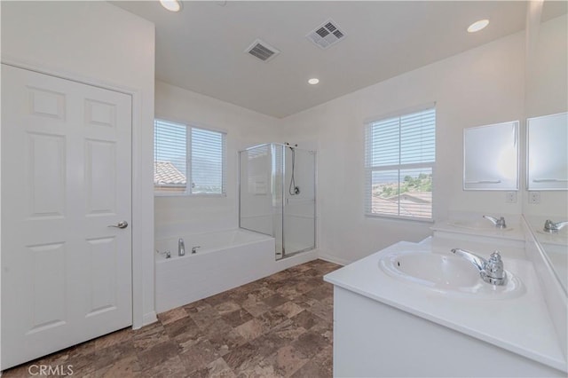 24679 Acadia Dr, Corona, CA 92883 - bathroom featuring healthy amount of natural light, a garden tub, a shower stall, double vanity, and recessed lighting