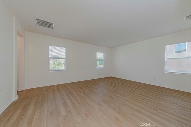 24679 Acadia Dr, Corona, CA 92883 - empty room with light wood-type flooring and baseboards