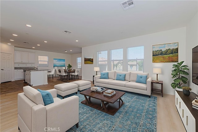 24679 Acadia Dr, Corona, CA 92883 - living area featuring light wood-style flooring and recessed lighting