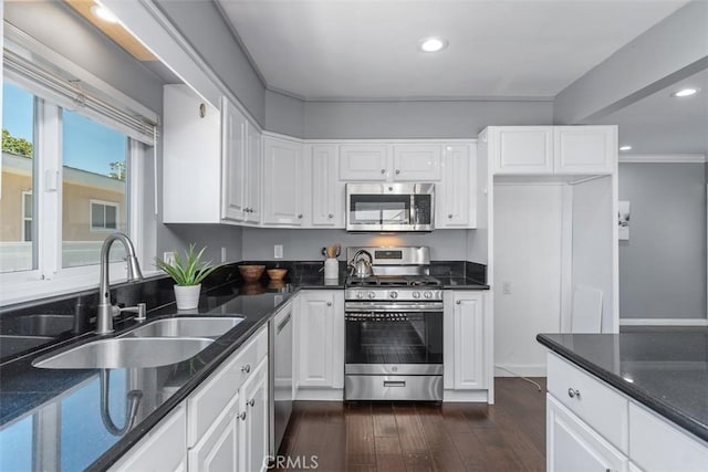 5337 Canehill Ave, Lakewood, CA 90713 - kitchen with appliances with stainless steel finishes, recessed lighting, white cabinets, dark stone counters, and dark wood-style floors