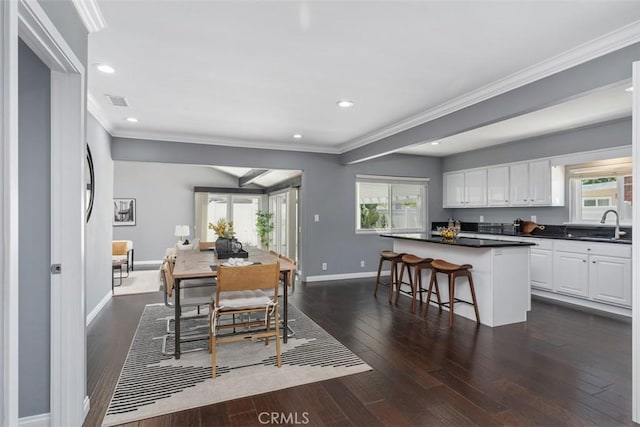 5337 Canehill Ave, Lakewood, CA 90713 - dining room featuring crown molding, dark wood-style floors, and recessed lighting