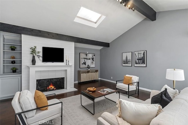5337 Canehill Ave, Lakewood, CA 90713 - living area featuring a skylight, wood finished floors, and a brick fireplace
