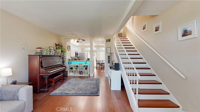 28305 Paseo El Siena Unit 10, Laguna Niguel, CA 92677 - living area featuring stairway, a ceiling fan, and wood finished floors