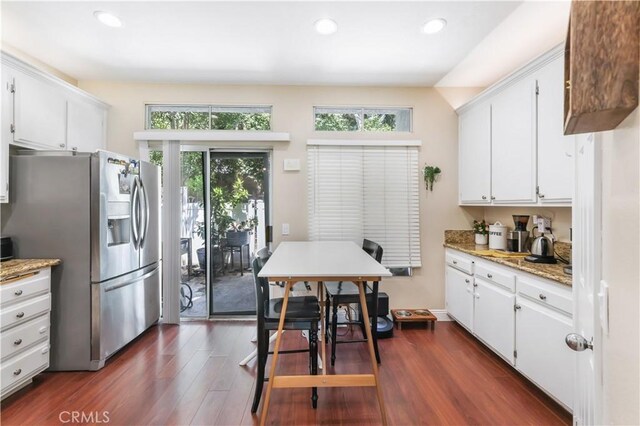 28305 Paseo El Siena Unit 10, Laguna Niguel, CA 92677 - kitchen with stainless steel fridge with ice dispenser, dark wood-style flooring, white cabinets, recessed lighting, and light stone countertops