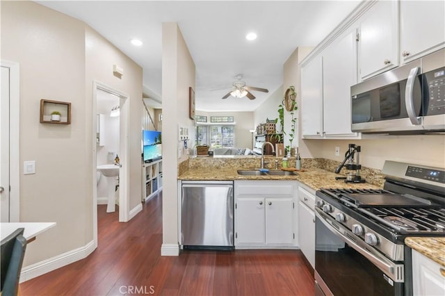28305 Paseo El Siena Unit 10, Laguna Niguel, CA 92677 - kitchen featuring stainless steel appliances, ceiling fan, dark wood-style floors, white cabinetry, and recessed lighting