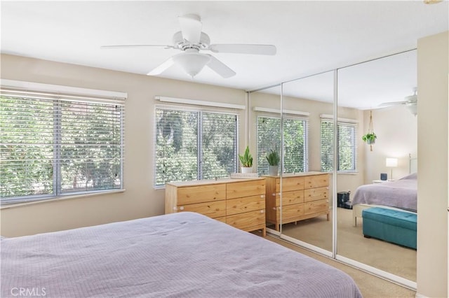 28305 Paseo El Siena Unit 10, Laguna Niguel, CA 92677 - carpeted bedroom with multiple windows, ceiling fan, and a closet