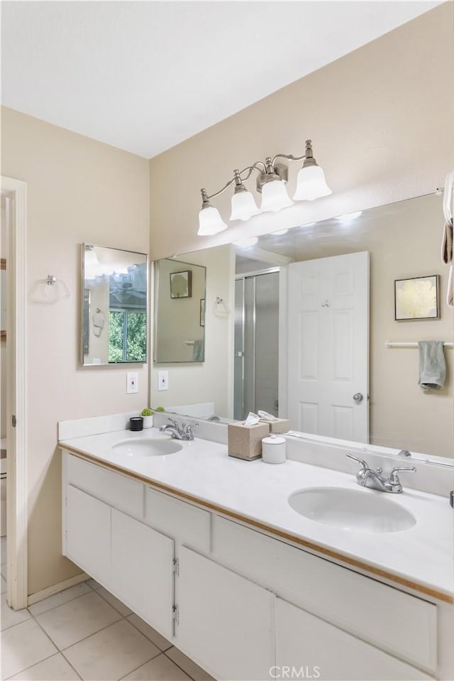 28305 Paseo El Siena Unit 10, Laguna Niguel, CA 92677 - full bath featuring double vanity, tile patterned floors, and a stall shower