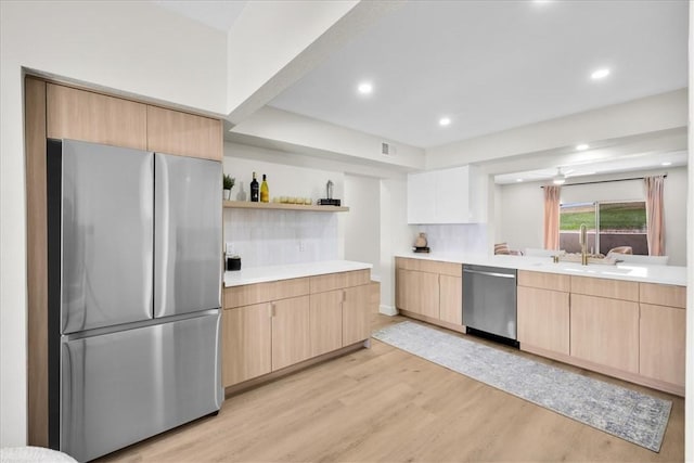 191 Desert Falls Cir, Palm Desert, CA 92211 - kitchen with appliances with stainless steel finishes, light brown cabinets, light wood-type flooring, open shelves, and light countertops