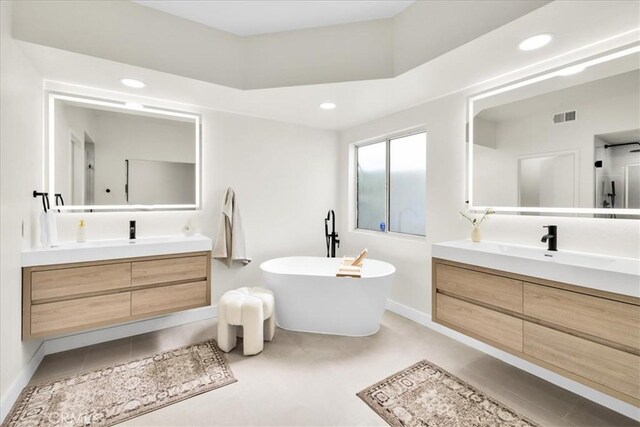 191 Desert Falls Cir, Palm Desert, CA 92211 - full bath featuring vanity, a freestanding bath, and recessed lighting