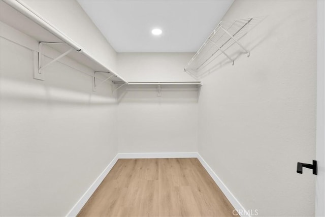 191 Desert Falls Cir, Palm Desert, CA 92211 - spacious closet featuring light wood finished floors