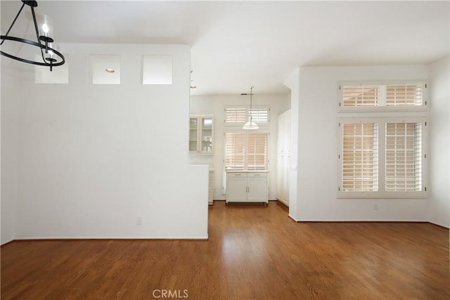 6 Garzoni Aisle, Irvine, CA 92606 - unfurnished dining area with a chandelier and wood finished floors