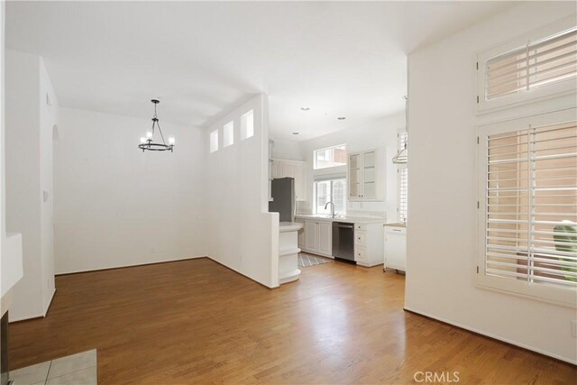 6 Garzoni Aisle, Irvine, CA 92606 - empty room with a chandelier and light wood-type flooring