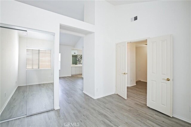6 Garzoni Aisle, Irvine, CA 92606 - empty room with wood finished floors and a towering ceiling