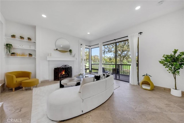 20 Nuevo Unit 10, Irvine, CA 92612 - living room with a warm lit fireplace and recessed lighting