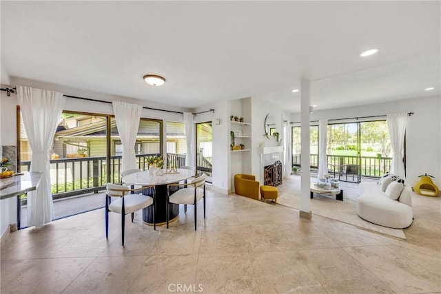 20 Nuevo Unit 10, Irvine, CA 92612 - dining area with recessed lighting, built in shelves, and a fireplace