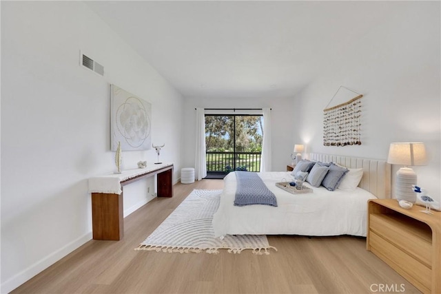 20 Nuevo Unit 10, Irvine, CA 92612 - bedroom featuring wood finished floors and access to exterior