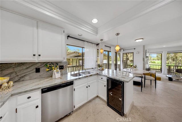 20 Nuevo Unit 10, Irvine, CA 92612 - kitchen featuring stainless steel dishwasher, beverage cooler, a peninsula, white cabinets, and recessed lighting