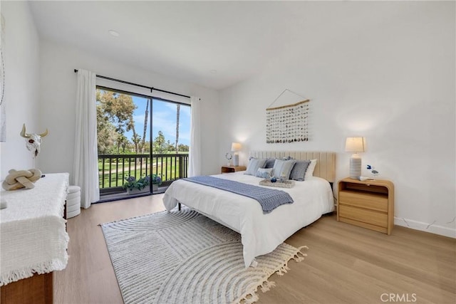 20 Nuevo Unit 10, Irvine, CA 92612 - bedroom with access to exterior and light wood-style flooring