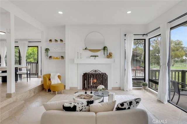 20 Nuevo Unit 10, Irvine, CA 92612 - living area featuring recessed lighting and a warm lit fireplace