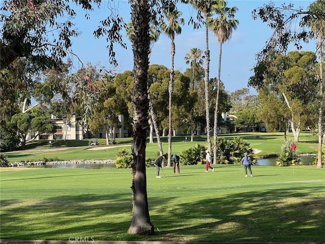 20 Nuevo Unit 10, Irvine, CA 92612 - view of home's community with a water view, a lawn, and golf course view