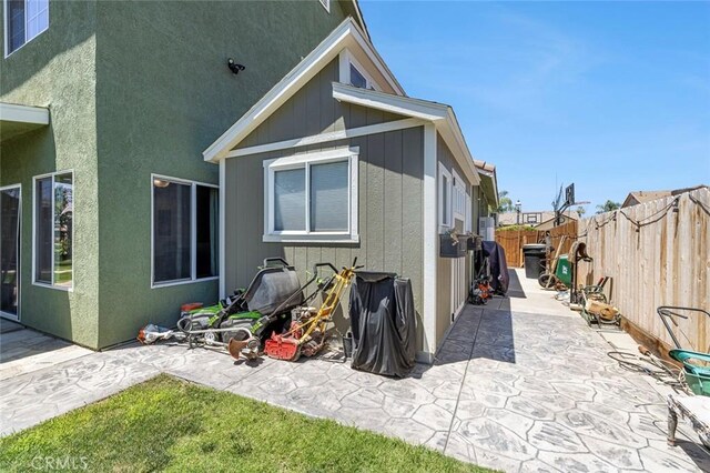6 N Post Ave, Sanger, CA 93657 - rear view of house featuring a patio area and a fenced backyard
