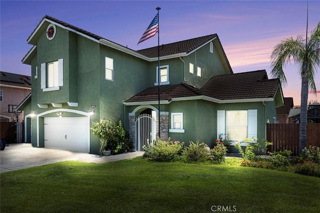 6 N Post Ave, Sanger, CA 93657 - traditional-style house featuring stucco siding, a tiled roof, and a garage
