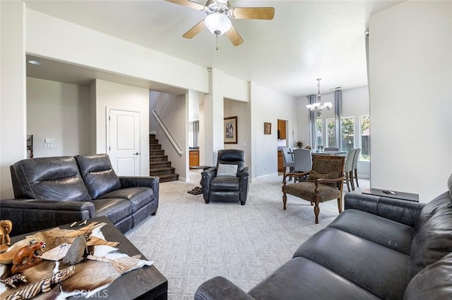 6 N Post Ave, Sanger, CA 93657 - living area with stairs, light colored carpet, a chandelier, and a ceiling fan