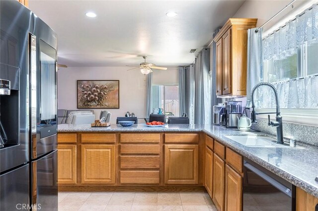 6 N Post Ave, Sanger, CA 93657 - kitchen featuring stainless steel fridge with ice dispenser, black dishwasher, a peninsula, brown cabinets, and a ceiling fan
