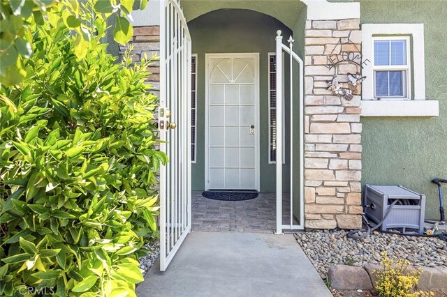 6 N Post Ave, Sanger, CA 93657 - entrance to property featuring stucco siding and stone siding