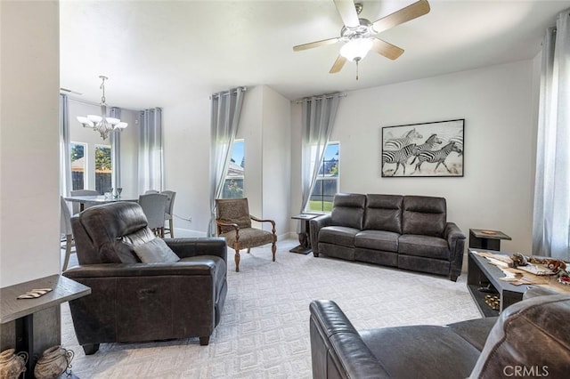 6 N Post Ave, Sanger, CA 93657 - living area with a chandelier, healthy amount of natural light, light colored carpet, and a ceiling fan