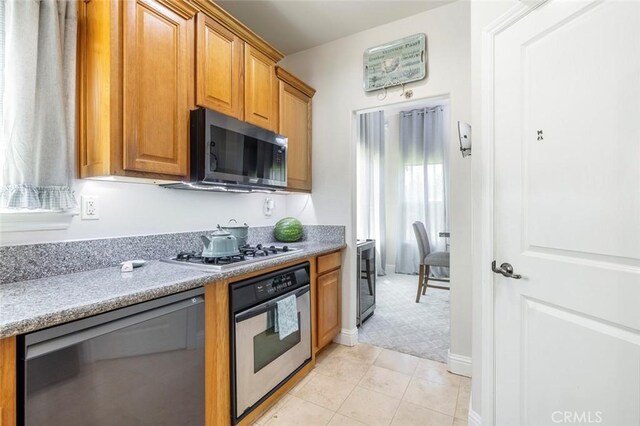 6 N Post Ave, Sanger, CA 93657 - kitchen with black microwave, oven, dishwasher, gas stovetop, and wine cooler