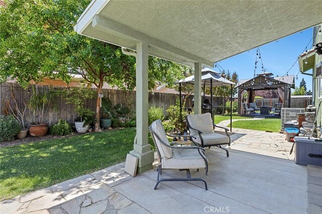6 N Post Ave, Sanger, CA 93657 - fenced backyard with a gazebo and a patio