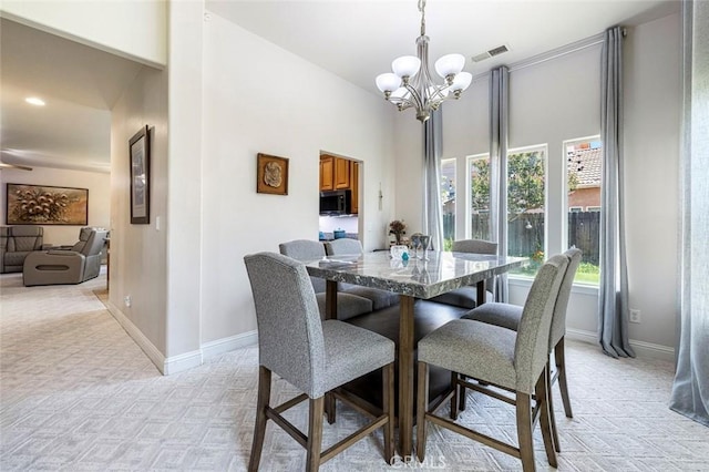 6 N Post Ave, Sanger, CA 93657 - dining room with a chandelier and light carpet