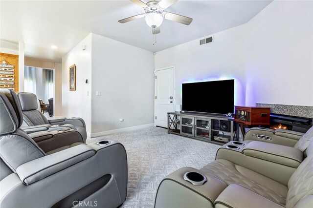 6 N Post Ave, Sanger, CA 93657 - carpeted living area with a ceiling fan and baseboards