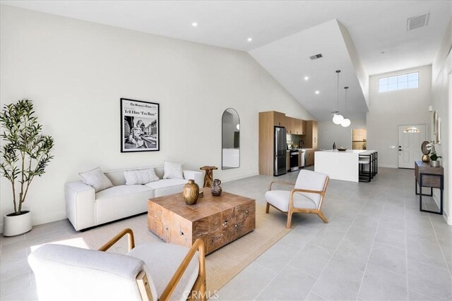 42407 Liolios Dr, Palm Desert, CA 92211 - living room featuring high vaulted ceiling and light tile patterned flooring