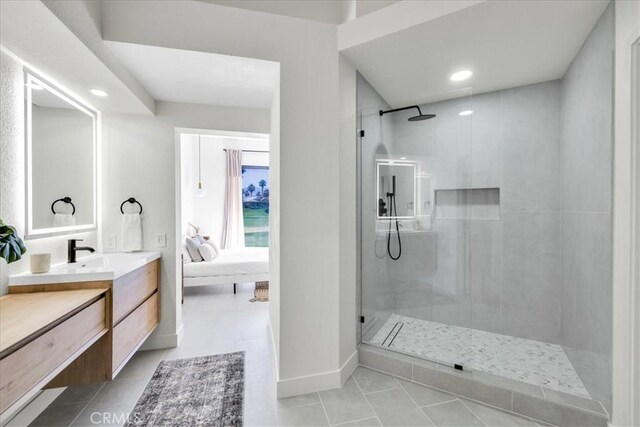 42407 Liolios Dr, Palm Desert, CA 92211 - full bathroom with a walk in shower, connected bathroom, vanity, tile patterned floors, and recessed lighting