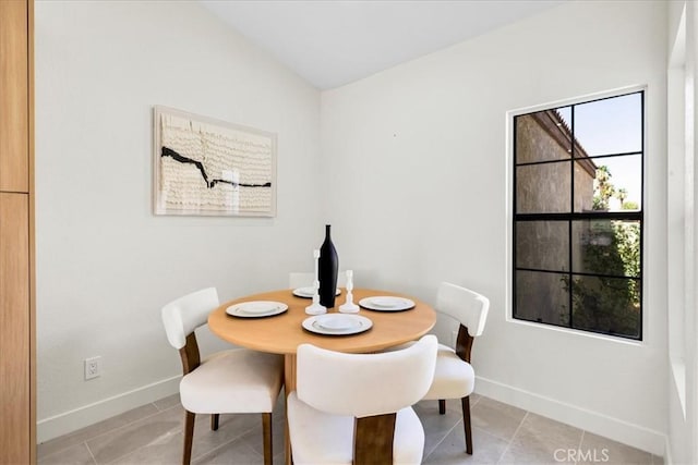 42407 Liolios Dr, Palm Desert, CA 92211 - dining room with light tile patterned floors and vaulted ceiling