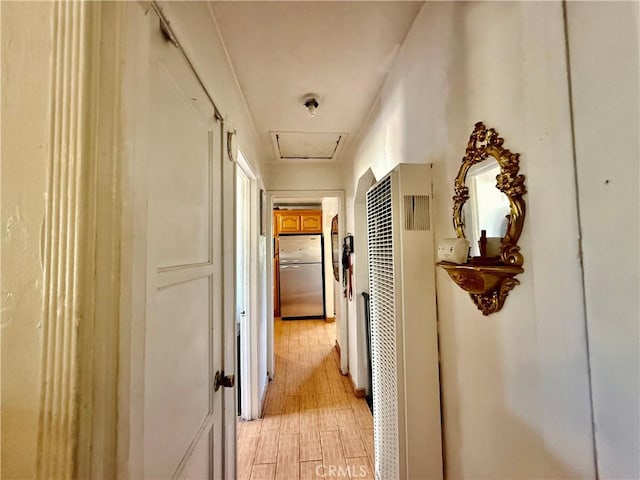 1246 W Mill St, San Bernardino, CA 92410 - hallway featuring a heating unit and light wood-type flooring