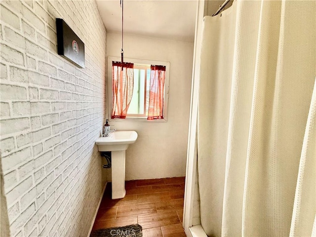 1246 W Mill St, San Bernardino, CA 92410 - full bath featuring hardwood / wood-style floors and curtained shower
