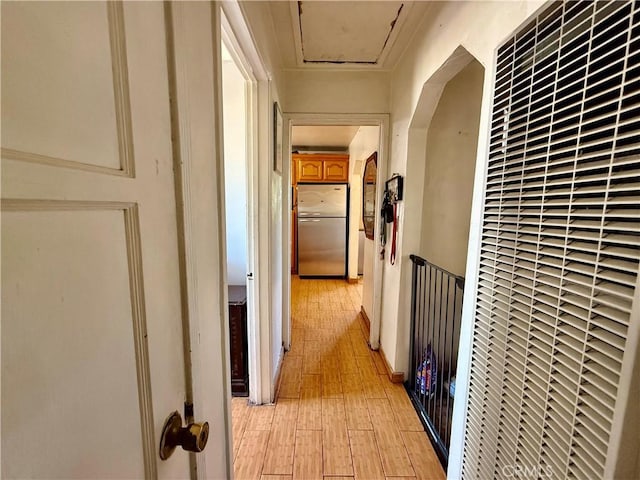 1246 W Mill St, San Bernardino, CA 92410 - hall featuring a heating unit and light wood-type flooring