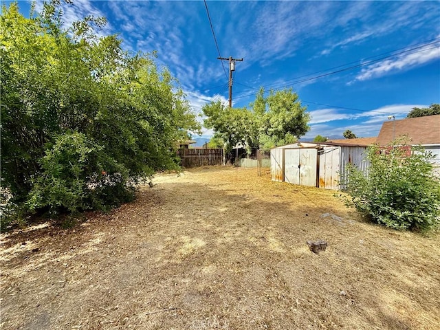 1246 W Mill St, San Bernardino, CA 92410 - view of yard featuring a storage unit