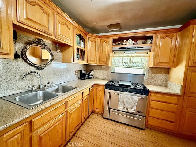 1246 W Mill St, San Bernardino, CA 92410 - kitchen featuring stainless steel gas range, under cabinet range hood, and light countertops