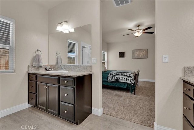 2454 W Mallard Ln, Hanford, CA 93230 - ensuite bathroom featuring vanity, a ceiling fan, and an enclosed shower